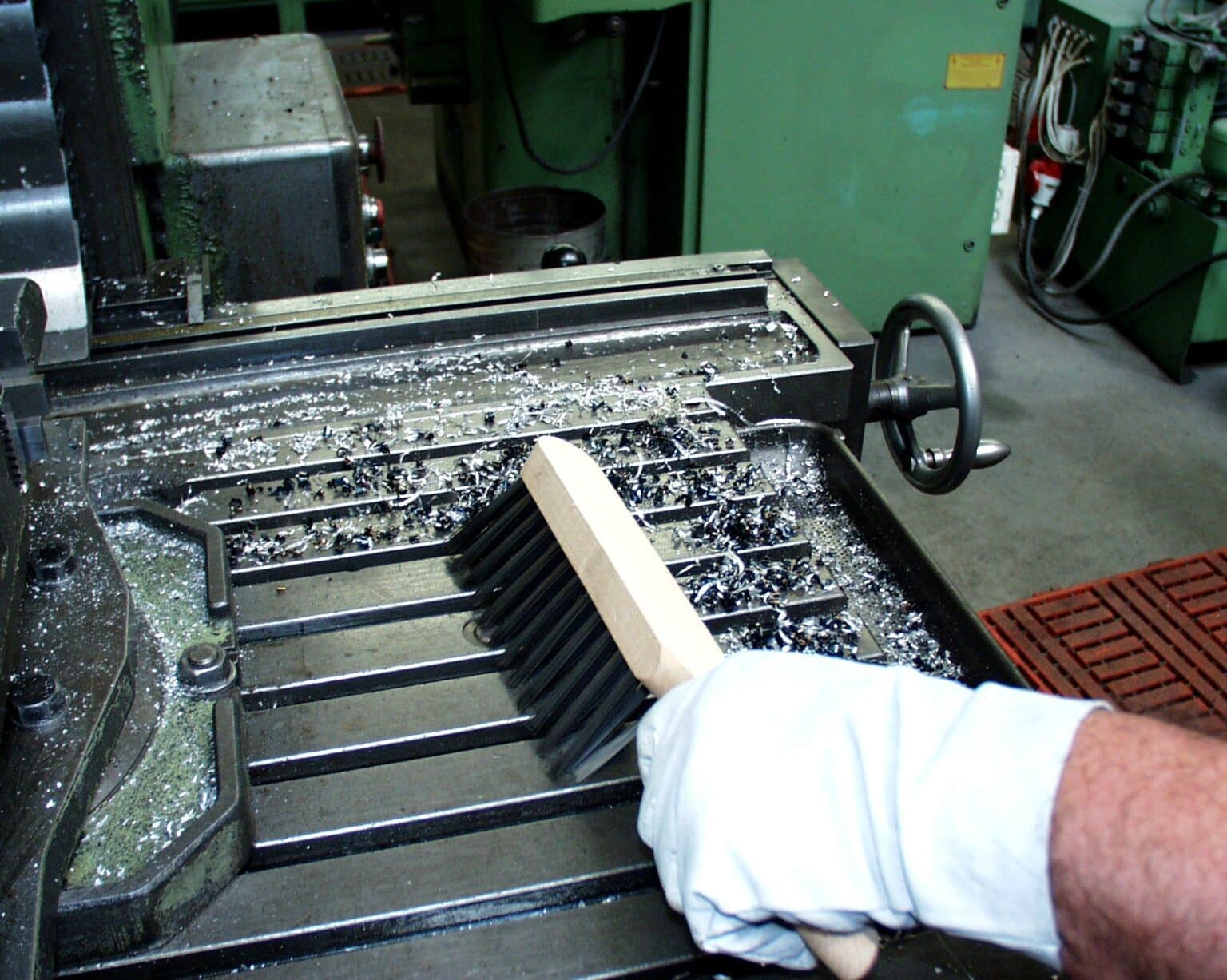 Hand brush for sweeping sawdust